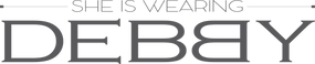 Text 'SHE IS WEARING DEBBY' in a decorative font on a white background