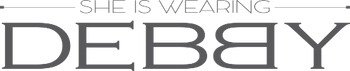 Text 'SHE IS WEARING DEBBY' in a decorative font on a white background